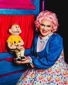 picture of a lady and her puppet 